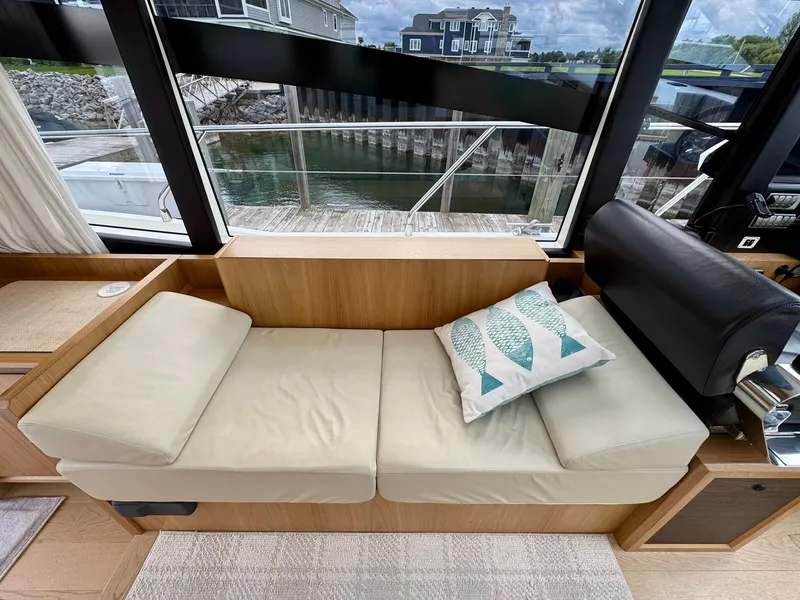 Slide: The Image of Interior of 2016 Absolute Sport Yacht with beige seating and decorative fish pillow. - 45