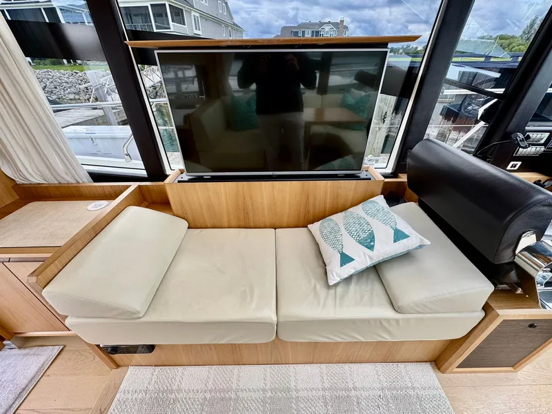 Slide: The Image of Luxurious interior of a 2016 Absolute Sport Yacht with a cozy seating area and TV. - 46