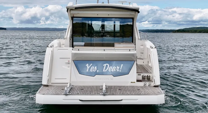 Slide: The Image of 2016 Absolute Sport Yacht on water, rear view with "Yes, Dear!" sign. - 8