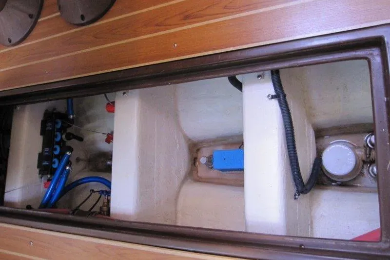 Slide: The Image of Interior view of a 2004 Catalina 350 MkII sailboat's engine compartment. - 25