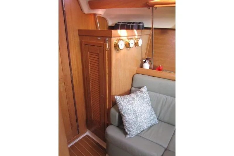 Slide: The Image of Interior of 2004 Catalina 350 MkII sailboat with wood paneling and cushioned seating. - 27