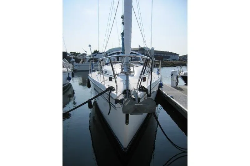 Slide: The Image of 2004 Catalina 350 MkII sailboat docked in a marina, front view. - 30
