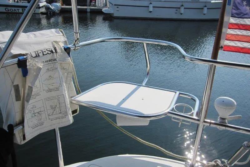 Slide: The Image of Sailboat stern view with lifebuoy holder, Catalina 350 MkII, 2004 model, docked in marina. - 32