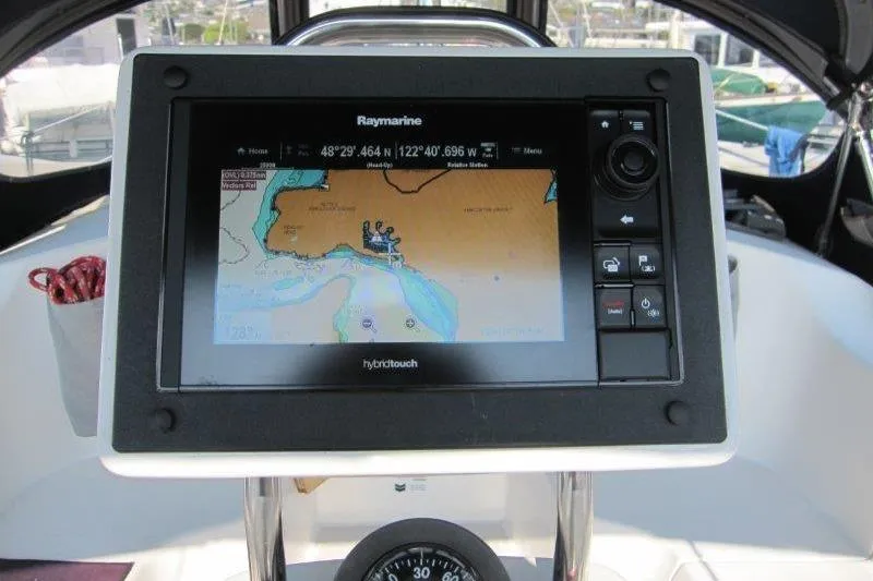 Slide: The Image of Raymarine navigation system on 2004 Catalina 350 MkII sailboat, displaying nautical chart. - 34