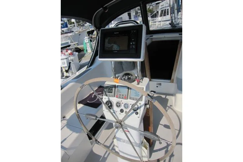 Slide: The Image of Cockpit of 2004 Catalina 350 MkII sailboat with navigation equipment and steering wheel. - 35