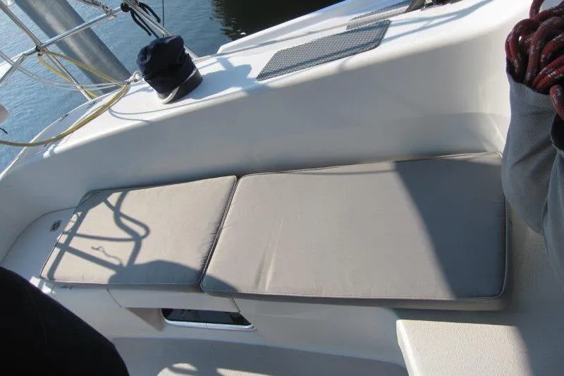 Slide: The Image of Cockpit seating on a 2004 Catalina 350 MkII sailboat, featuring cushioned benches. - 46