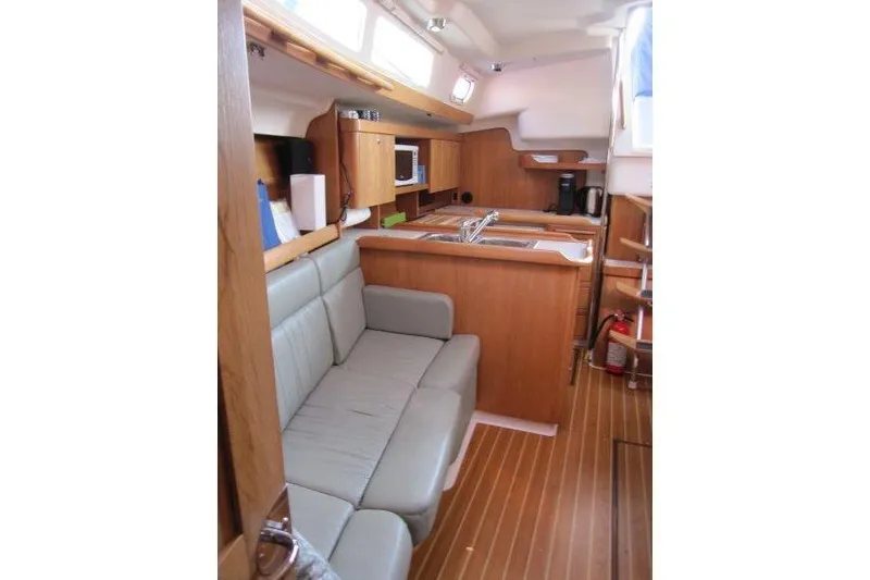Slide: The Image of Interior of 2004 Catalina 350 MkII sailboat with wood finish and cozy seating area. - 8