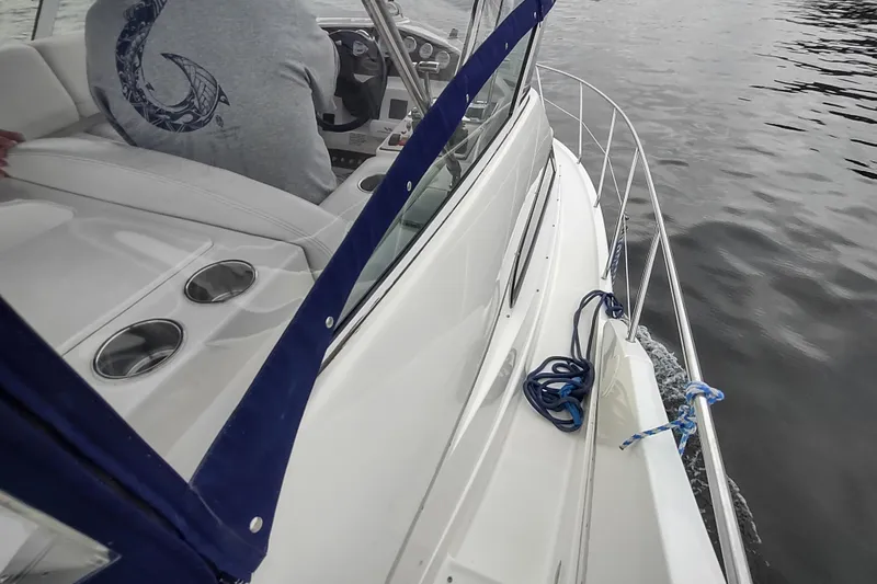 Slide: The Image of 2003 Silverton 330 Sport Bridge cruising on calm waters, interior view with steering console. - 26