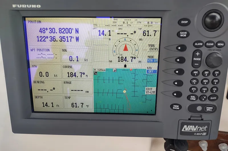 Slide: The Image of Furuno navigation display on 2003 Silverton 330 Sport Bridge showing coordinates and course details. - 43