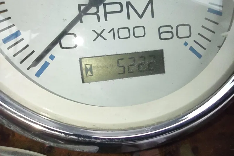 Slide: The Image of Close-up of 2003 Silverton 330 Sport Bridge RPM gauge displaying 5222 hours. - 47