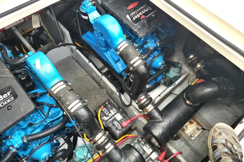 Slide: The Image of Engine compartment of a 2003 Silverton 330 Sport Bridge with Crusader engines. - 48