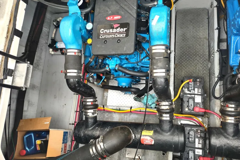 Slide: The Image of Engine room of a 2003 Silverton 330 Sport Bridge with Crusader engine components. - 49