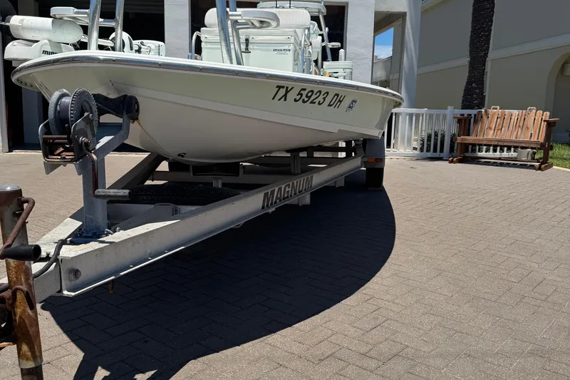 Slide: The Image of Boat on trailer, NewWater Ibis 2007, parked on paved driveway. - 3