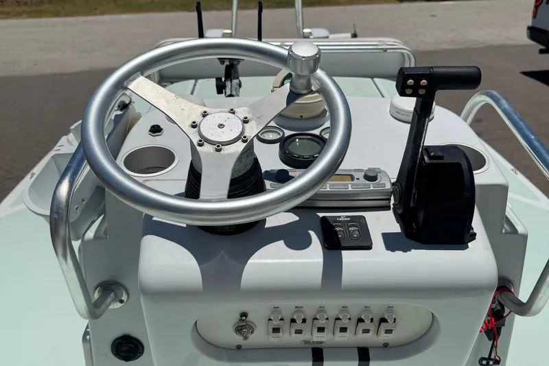 Slide: The Image of Steering console of a 2007 NewWater Ibis boat with controls and gauges. - 6