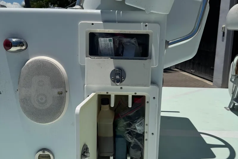 Slide: The Image of Console storage on a 2007 NewWater Ibis boat with speaker and compartments. - 7