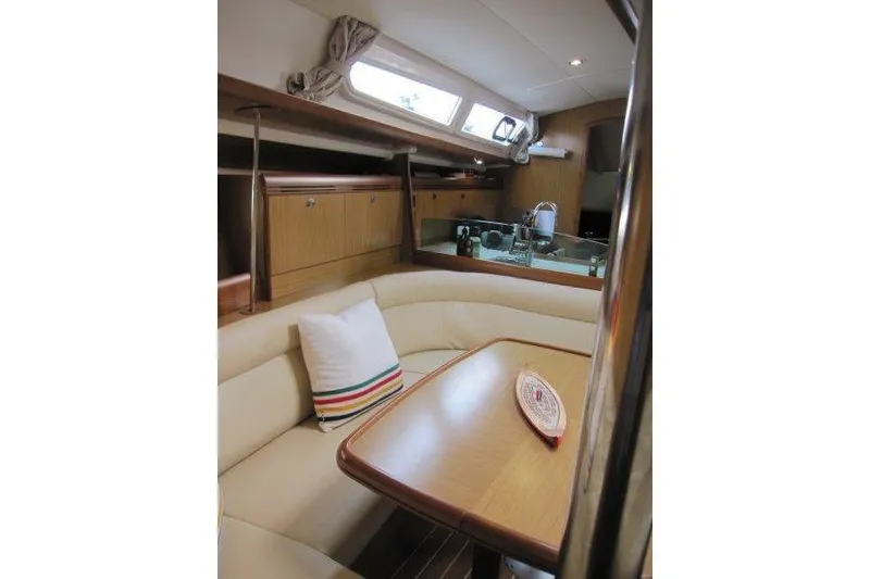 Slide: The Image of Interior of 2008 Jeanneau Sun Odyssey 39i yacht with cozy seating and modern kitchen. - 12
