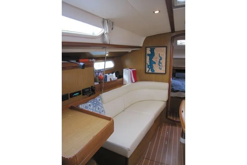 Slide: The Image of Interior of 2008 Jeanneau Sun Odyssey 39i yacht with cozy seating and nautical decor. - 15