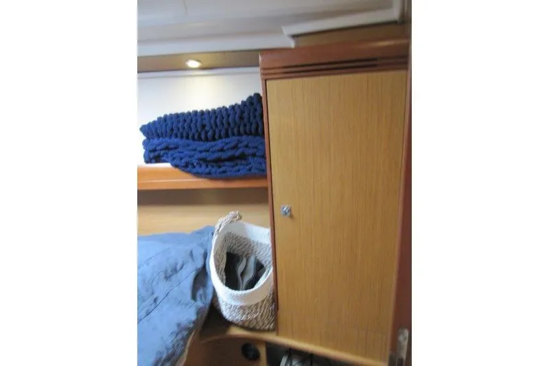 Slide: The Image of Interior cabin of 2008 Jeanneau Sun Odyssey 39i with storage and bedding. - 20