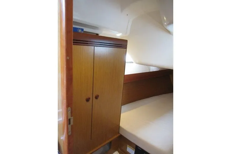 Slide: The Image of Interior cabin of 2008 Jeanneau Sun Odyssey 39i sailboat with wooden wardrobe. - 25
