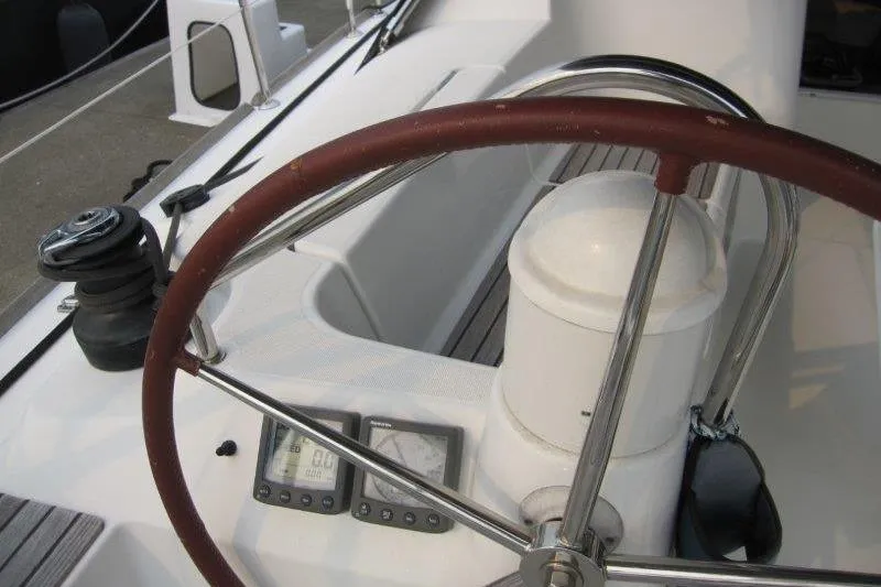Slide: The Image of Steering wheel and instruments on 2008 Jeanneau Sun Odyssey 39i sailboat deck. - 35
