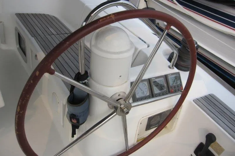 Slide: The Image of Steering wheel and controls of 2008 Jeanneau Sun Odyssey 39i sailboat cockpit. - 38