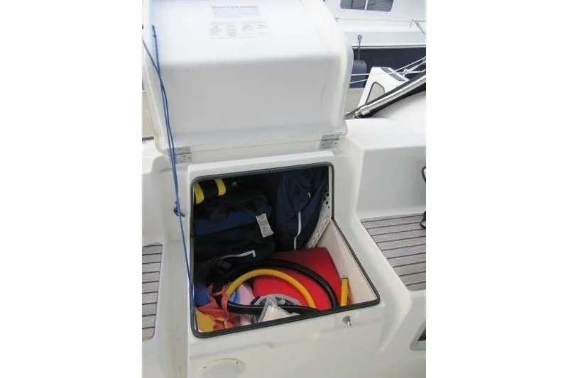 Slide: The Image of Storage compartment on 2008 Jeanneau Sun Odyssey 39i sailboat, filled with boating gear. - 51