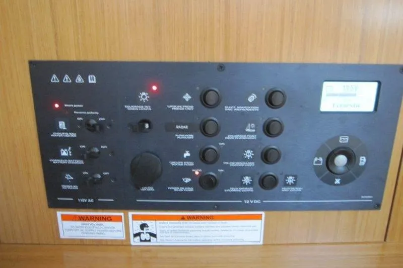 Slide: The Image of Control panel of 2008 Jeanneau Sun Odyssey 39i yacht, featuring various switches and indicators. - 7