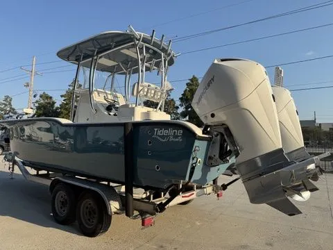 Slide: The Image of 2020 Tideline 235 Hybrid boat on trailer with dual outboard motors. - 13