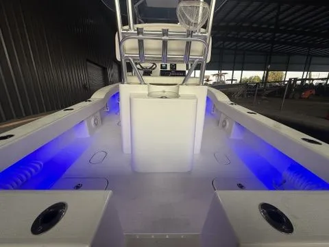 Slide: The Image of 2020 Tideline 235 Hybrid boat interior with blue LED lighting in a covered dock. - 17