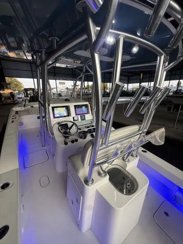 Slide: The Image of 2020 Tideline 235 Hybrid boat interior with modern controls and blue LED lighting. - 21