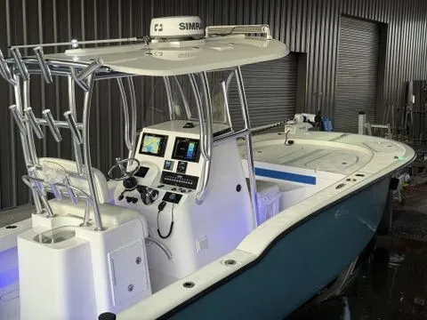 Slide: The Image of 2020 Tideline 235 Hybrid boat with advanced navigation system in a storage facility. - 34