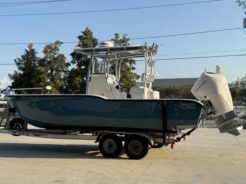 Slide: The Image of 2020 Tideline 235 Hybrid boat on trailer, parked outdoors. - 5
