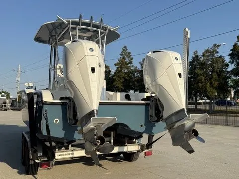 Slide: The Image of 2020 Tideline 235 Hybrid boat with dual outboard motors on a trailer. - 8