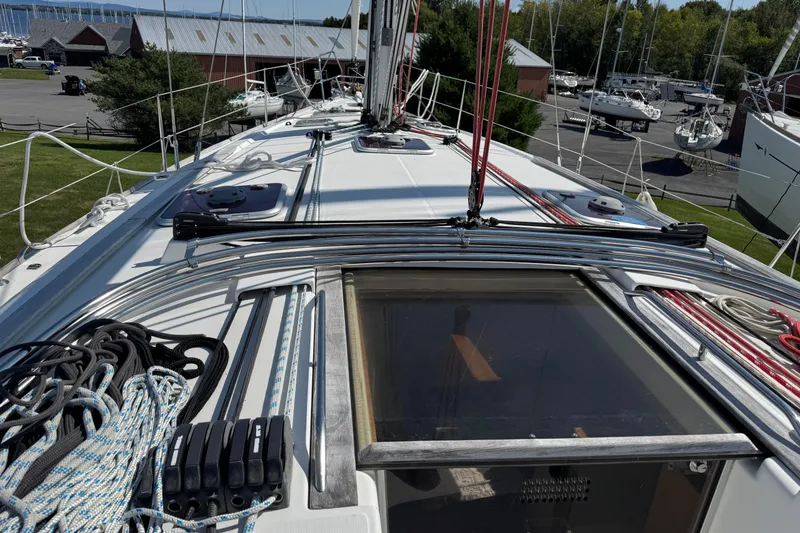 Slide: The Image of Deck view of 2009 Jeanneau Sun Odyssey 44i sailboat with rigging and ropes. - 11