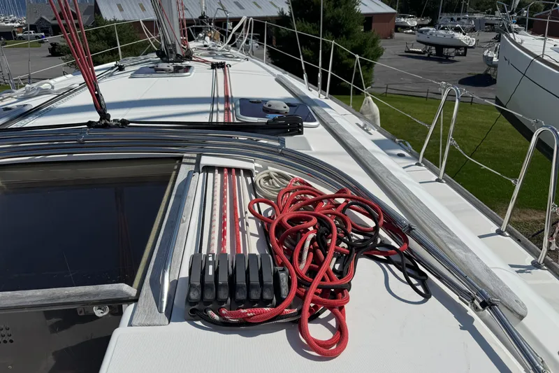 Slide: The Image of 2009 Jeanneau Sun Odyssey 44i sailboat deck with ropes and rigging. - 12