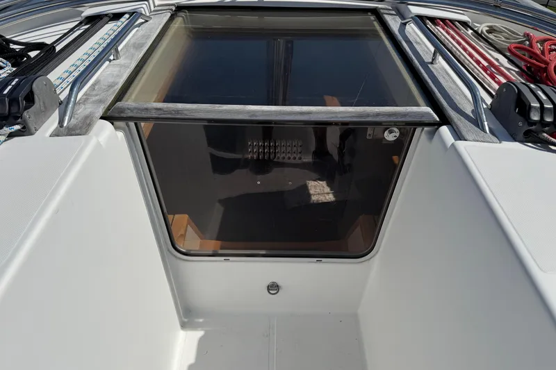 Slide: The Image of 2009 Jeanneau Sun Odyssey 44i yacht cockpit entrance with sliding hatch and control lines. - 13