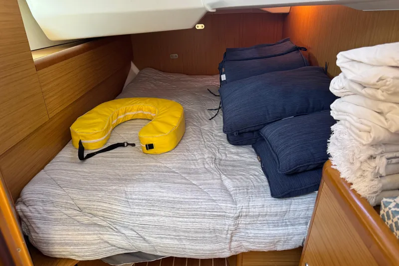 Slide: The Image of Cozy cabin interior of 2009 Jeanneau Sun Odyssey 44i with bedding and life jacket. - 27
