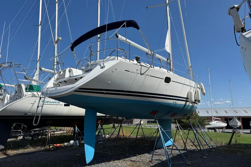 Slide: The Image of 2009 Jeanneau Sun Odyssey 44i sailboat on stands, clear sky background. - 3