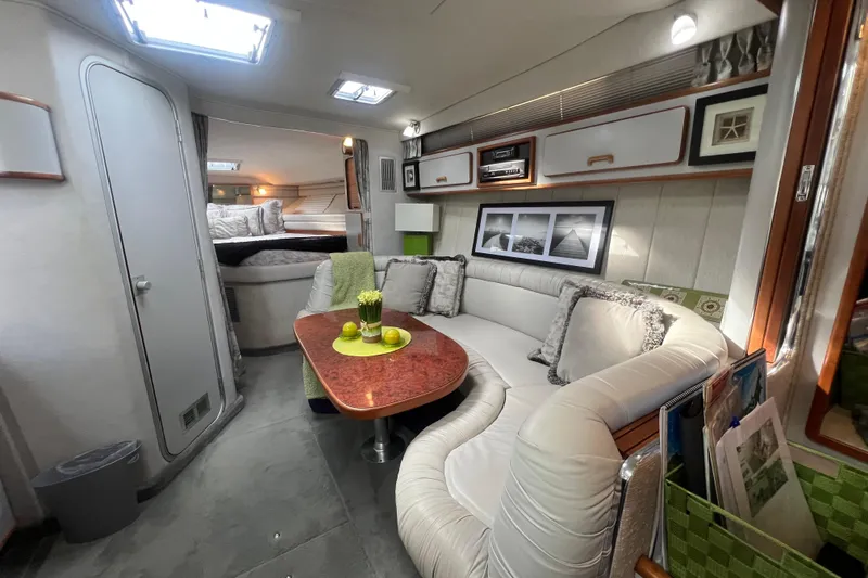 Slide: The Image of Luxurious interior of 1990 Sea Ray 350 Sundancer yacht with elegant seating and decor. - 14