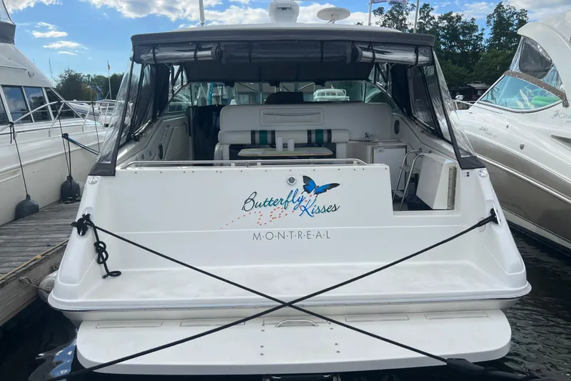 Slide: The Image of 1990 Sea Ray 350 Sundancer boat named "Butterfly Kisses" docked in Montreal. - 3