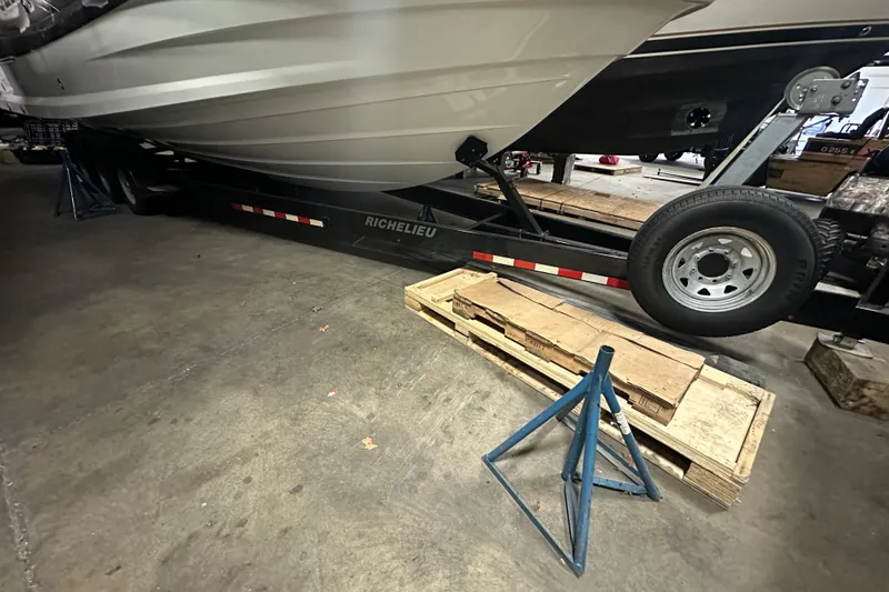 Slide: The Image of 2024 Galeon 325 GTO boat on trailer in a garage setting. - 5