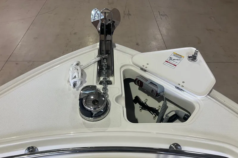 Slide: The Image of 2026 Boston Whaler 230 Outrage boat anchor system and storage compartment. - 14