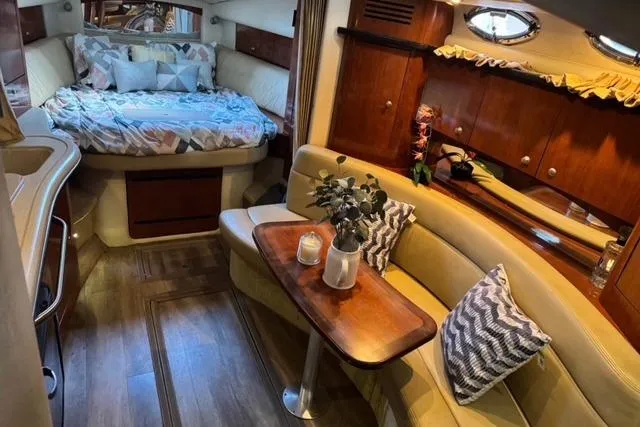 Slide: The Image of Luxurious 2007 Sea Ray 320 Sundancer cabin with cozy seating and elegant decor. - 10