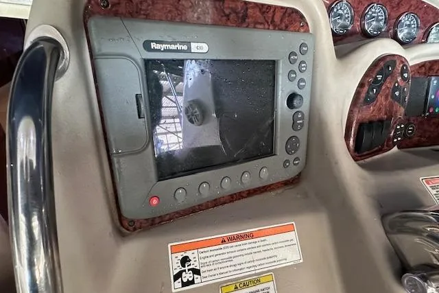Slide: The Image of Control panel of a 2007 Sea Ray 320 Sundancer with Raymarine navigation system. - 21