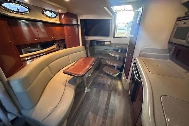 Slide: The Image of Luxurious 2007 Sea Ray 320 Sundancer interior with elegant seating and modern amenities. - 25
