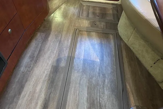 Slide: The Image of Interior view of 2007 Sea Ray 320 Sundancer with wood flooring and seating. - 32