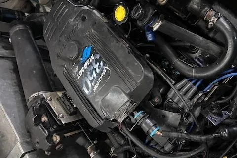 Slide: The Image of Engine of 2007 Sea Ray 320 Sundancer boat, showcasing mechanical components and details. - 38