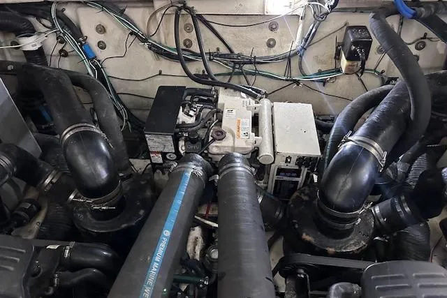 Slide: The Image of Engine room of a 2007 Sea Ray 320 Sundancer with visible components and wiring. - 40