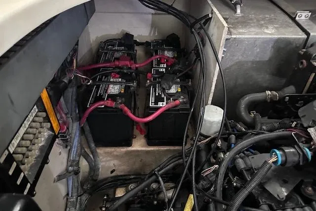 Slide: The Image of Engine compartment of a 2007 Sea Ray 320 Sundancer with visible batteries and wiring. - 41