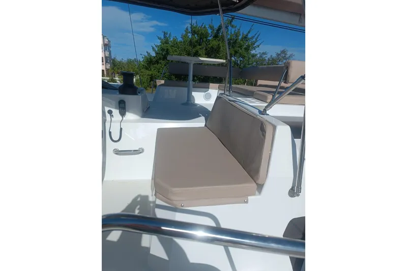 Slide: The Image of 2023 Bali 4.4 yacht deck with beige seating and modern fixtures. - 11